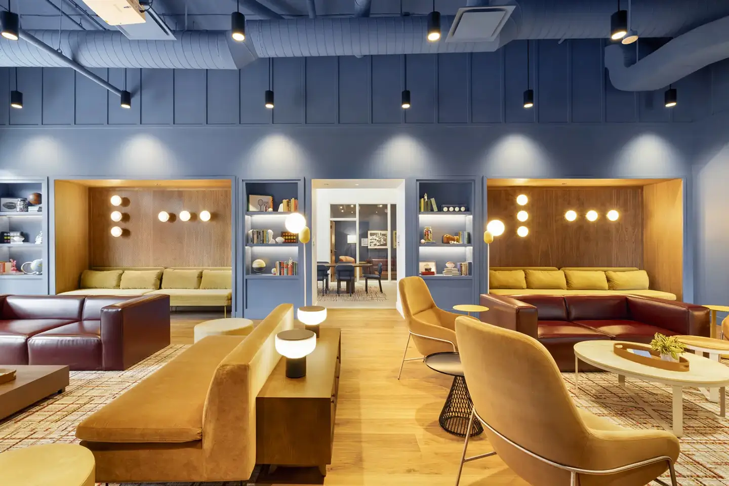 inside the shared spaces at ōLiv Hetzel, fitted with couches, chairs and booths